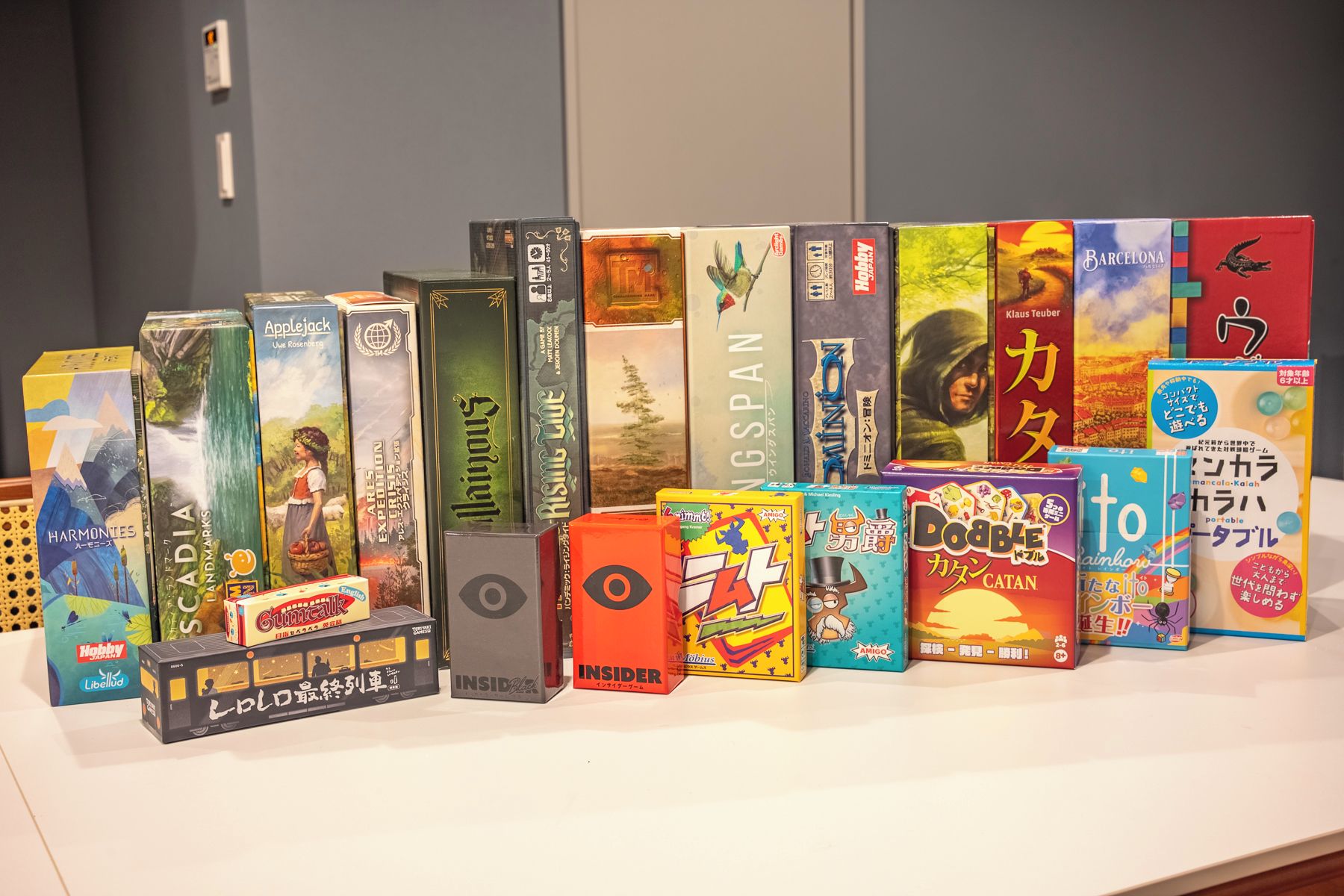 A variety of board games displayed on a table.