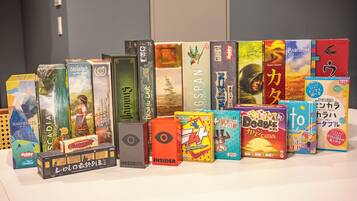 A variety of board games displayed on a table.