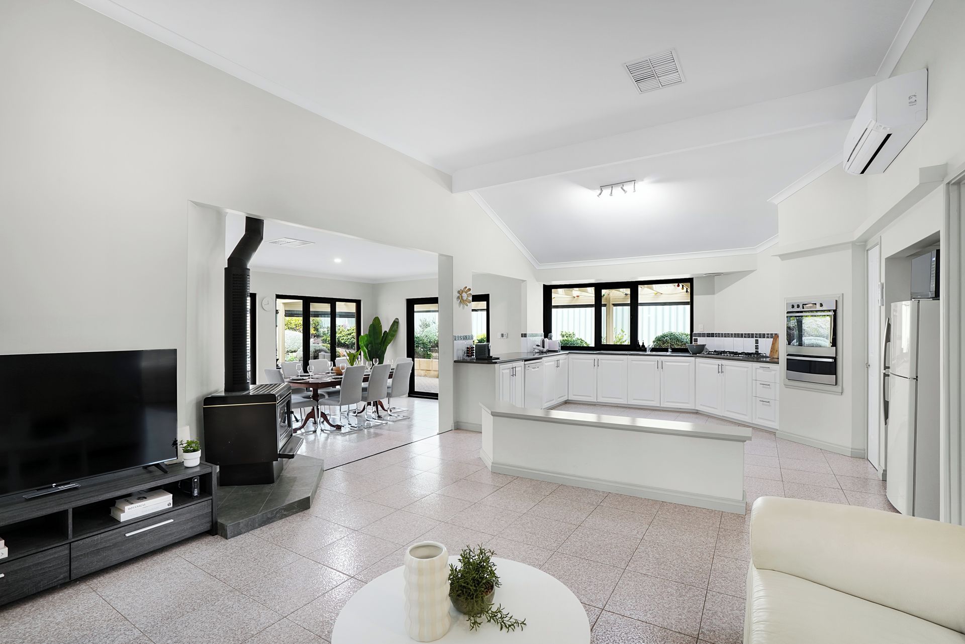 Spacious open plan where you can see the kitchen and the dining area for the living area. 