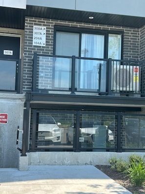 A building with multiple parking spaces labeled 307A, 308A, 204A, and 104A.