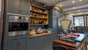 A kitchen with a built-in oven, a scale, and various kitchen utensils and appliances. - 🌿 La Bastide de la Colline, an authentic Provençal house with a private pool. (Cavaillon)
