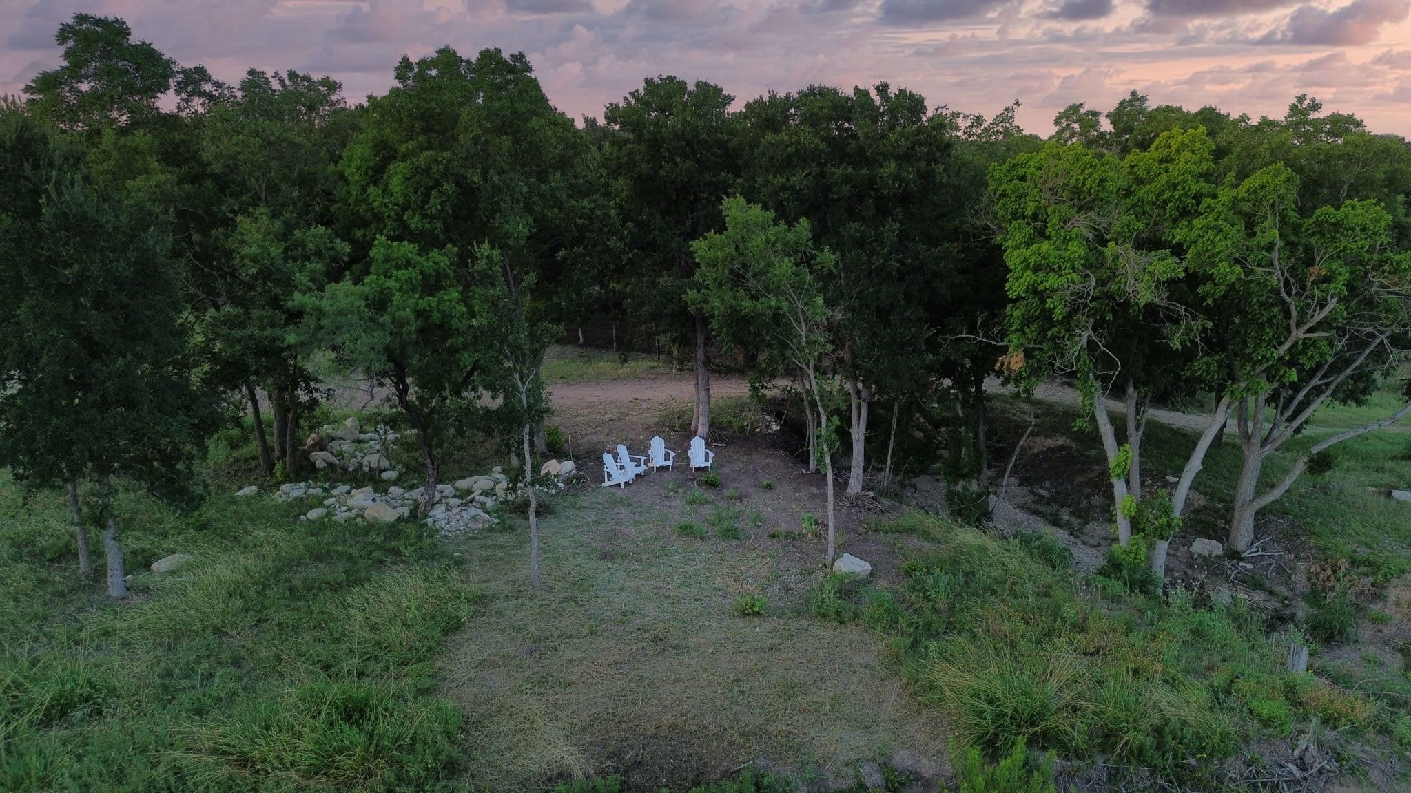 A natural outdoor setting with trees and rocks.