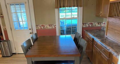 Escape to a cozy 4-bedroom, 2-bath home with a hot tub in historic Beverly
