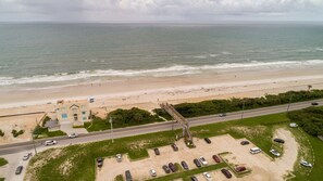 A coastal road with a beach and a building with a blue roof. - Private Heated Pool, Two Primary Suites, Short Walk to the Beach (St. Augustine)