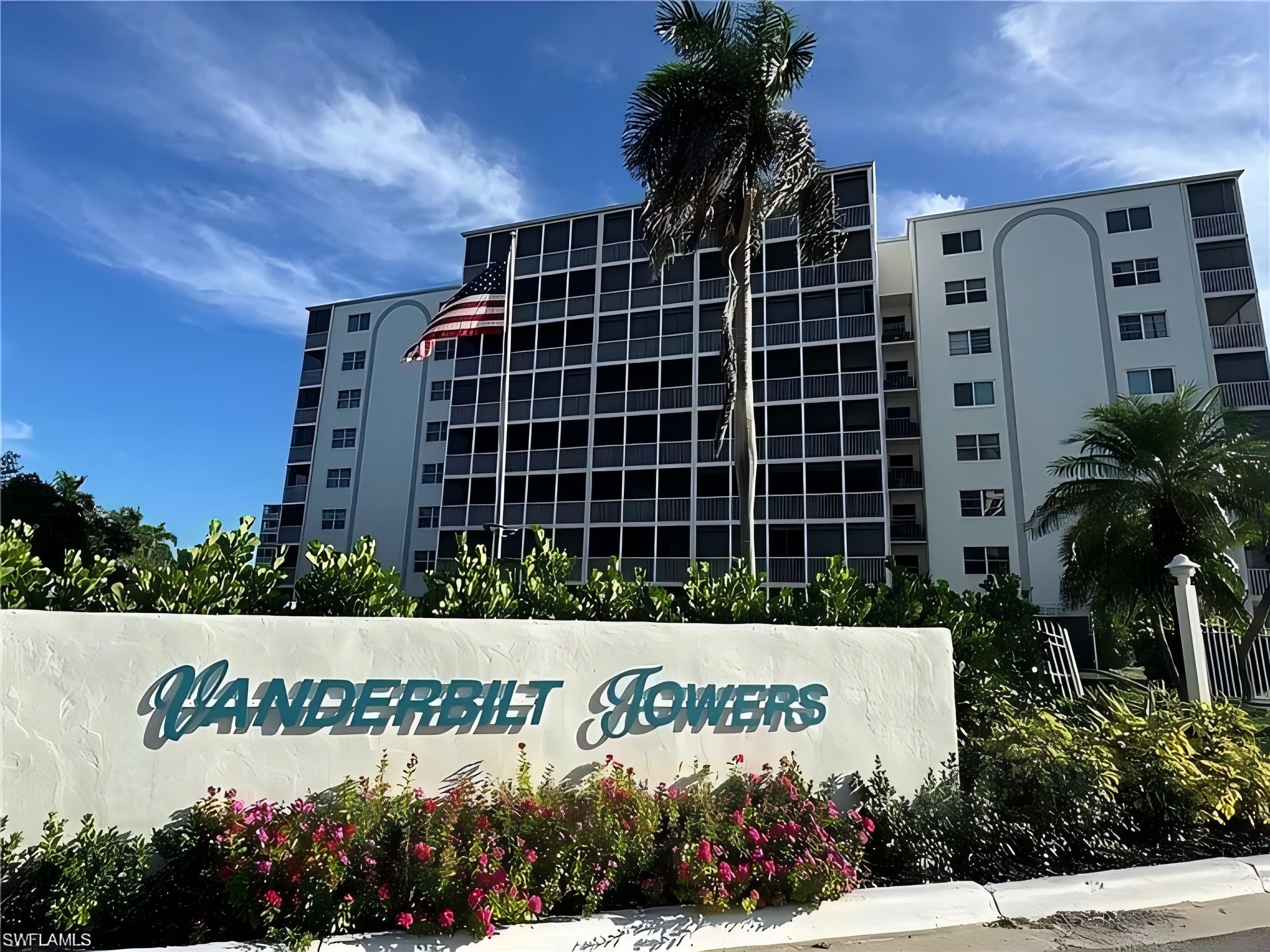 A multi-story building with a sign reading 'Vanderbilt Towers.'