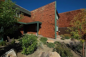 A modern house with a brick exterior and a green roof. - Upgraded Condo with Private Boat Dock - Ski Lease Available (South Lake Tahoe)