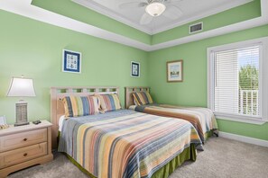 A bedroom with two beds, a nightstand with a lamp, and a window with blinds. - Beachfront 2BR @ Palm Beach Resort • Sleeps 7 • Stunning Views (Orange Beach)