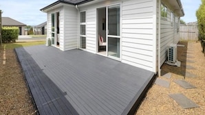 Unclassified image, 2 of 6, button - Cozy room in a newly built modern house. (Pukekohe)