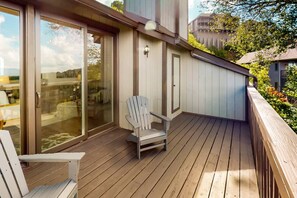 A wooden deck with a sliding glass door, a white Adirondack chair, and a small table. - Marla on the Mountain - Stunning Views, Sugar Mountain (Sugar Mountain)