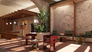 Un interior moderno con una escalera, zona de estar, obras de arte y un gran mural en la pared.