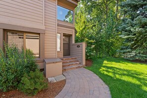 A two-story house with a brick pathway leading to the front door. - Beautiful 3 Bedroom SV Condo with Pool and Hot Tub (Sun Valley)