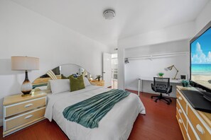 A bedroom with a bed, a desk, a chair, a TV, and a dresser. - Garage, Gated Yard, near SD Gaslamp, DT, 4BR/2Bth (National City)