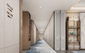 A hotel corridor with numbered doors, wooden paneling, a marble wall, and a built-in shelf with decorative items.