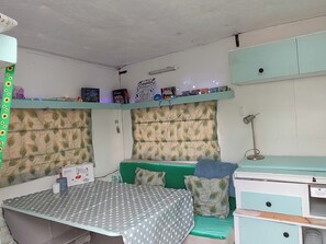 A bedroom with a bed, a desk, and a shelf with books and items. - Hideaway House, Sleeps 6 with Hot Tub & Balcony (Chester Le Street)