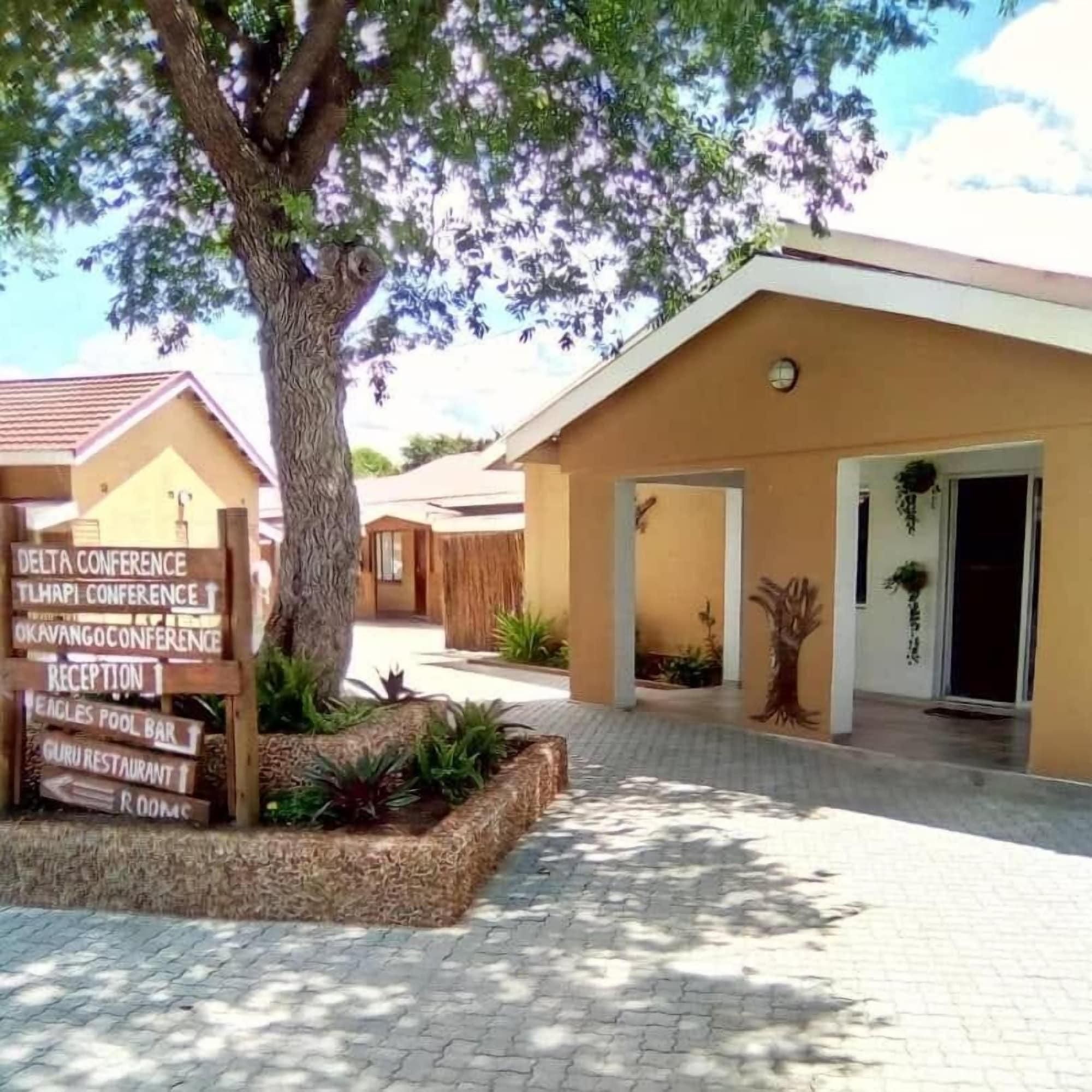 A building with a sign indicating a reception area and a pool bar.
