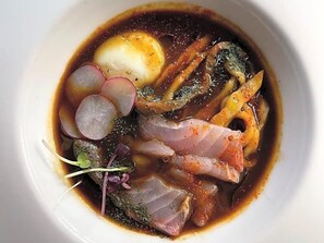 A bowl of food with various ingredients.
