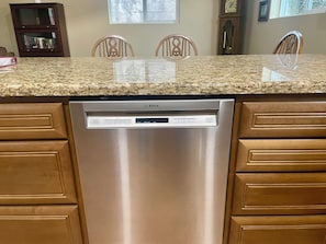 A Bosch dishwasher in a kitchen with wooden cabinets and a granite countertop. - Lakeside Escape: King Bed, 2 Lakes, 2 Reservoirs, & 30 min.to Beach / San Diego (Lakeside)