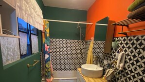 A bathroom with a patterned floor, a toilet, a sink, and a shower area. - Superb 1-bedroom apartment in vibrant Ciudad de México (Ciudad de México)