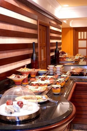 A buffet setup with various dishes and drinks. - Villa Park Hotels (Lagos)