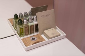 A display of L'OCCITANE products including bottles and a box. - Impresamente Art Hotel (Sofia)