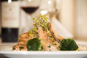 A plate with grilled chicken, broccoli, and sprouts. - Hotel Czerniewski (Warsaw)