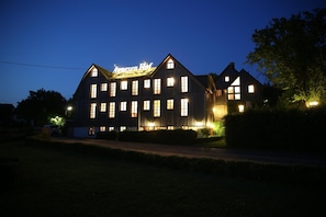 A large, multi-story building with a prominent sign at the top. - Hotel Agnesen Hof (Barweiler)