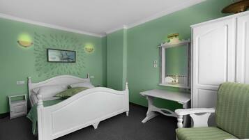 Ein Schlafzimmer mit Bett, Schreibtisch, Stuhl und Kommode.