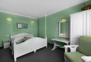 A bedroom with a bed, a desk, a chair, and a dresser.