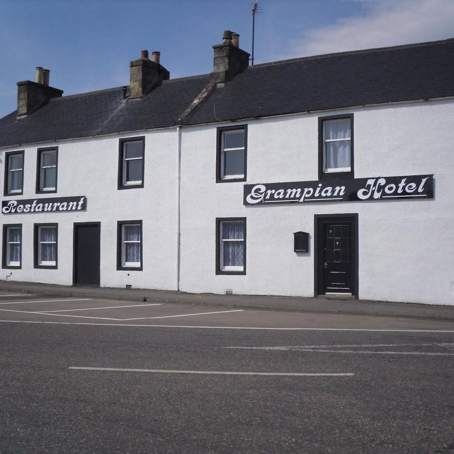 A building with a sign for 'Grampian Hotel' and a 'Restaurant' on the ground floor.