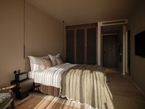 A bedroom with a bed, bedside table, and a wardrobe. - OKU Bodrum (Bodrum)