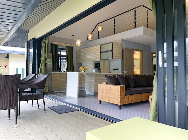 A modern living space with a kitchen, dining area, and seating. - New cozy vacation home on Bora Bora (bora bora)
