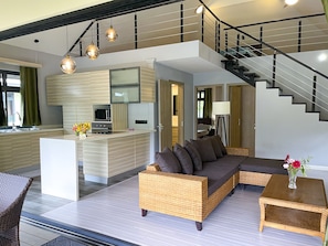 A modern interior with a kitchen, living area, and staircase. - New cozy vacation home on Bora Bora (bora bora)