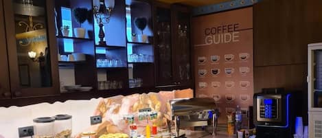 A coffee station with a coffee guide, a coffee machine, and various coffee-making accessories.
