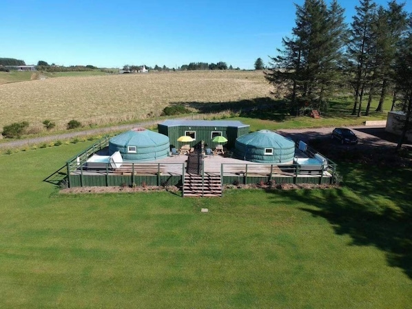 A yurt-style structure with a covered entrance and a small porch area. - Orange Yurt With Hot Tub- Sleeps 3, Parking & Pe (Turriff)