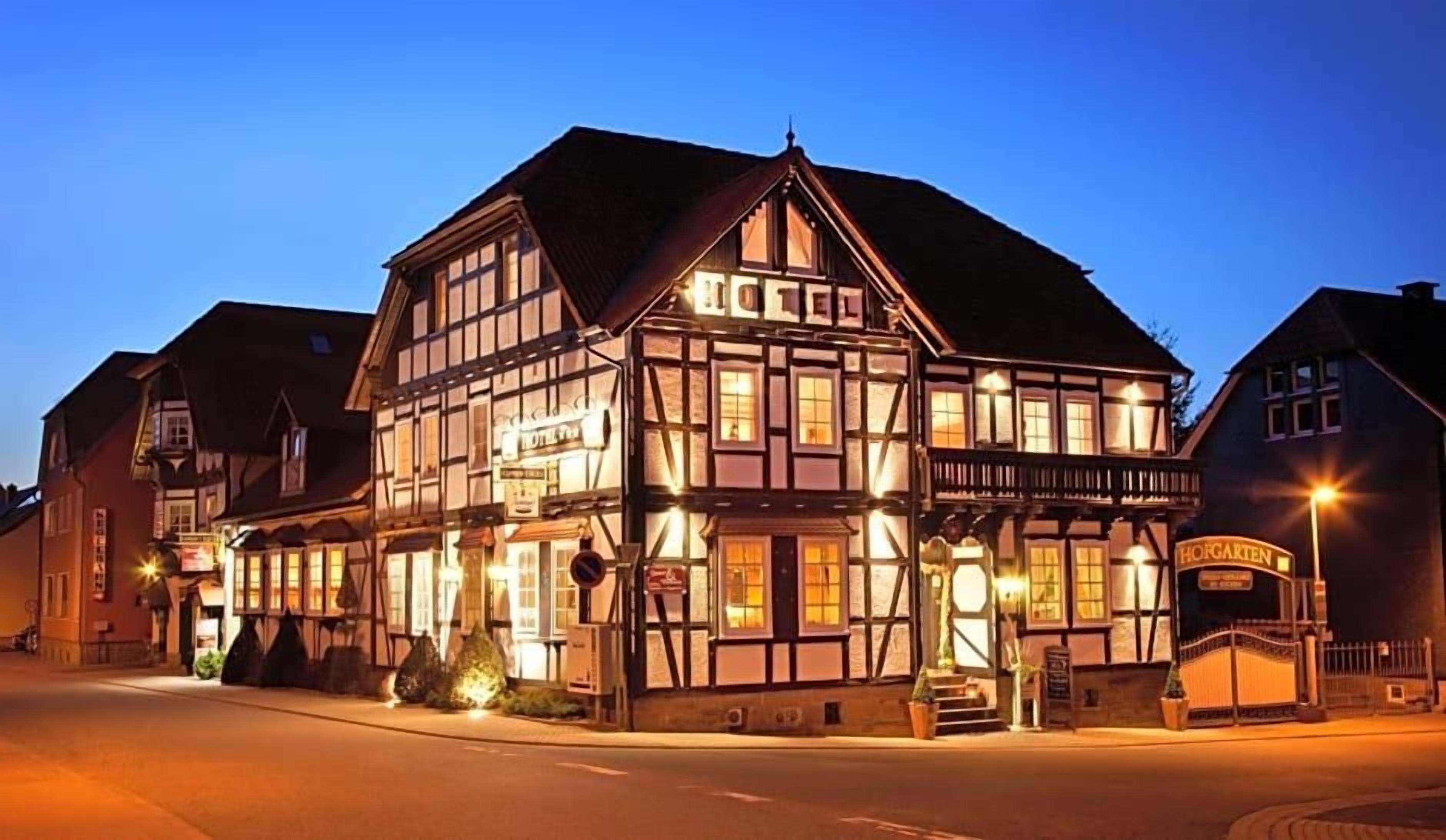 A traditional half-timbered building with a sign indicating it's a hotel.
