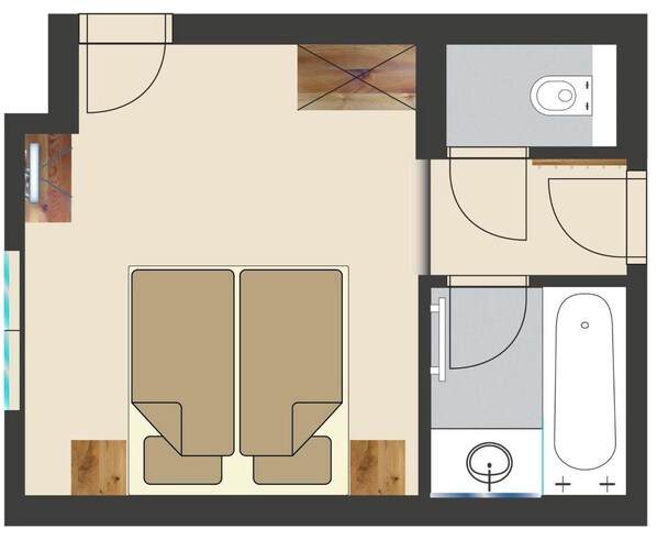 Plano de planta que muestra dos dormitorios, un baño, una cocina y una sala de estar.