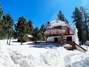 A two-story house with a balcony, surrounded by snow and trees. - Five Pines (Big Bear Lake)