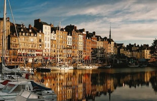 A waterfront with buildings and boats.