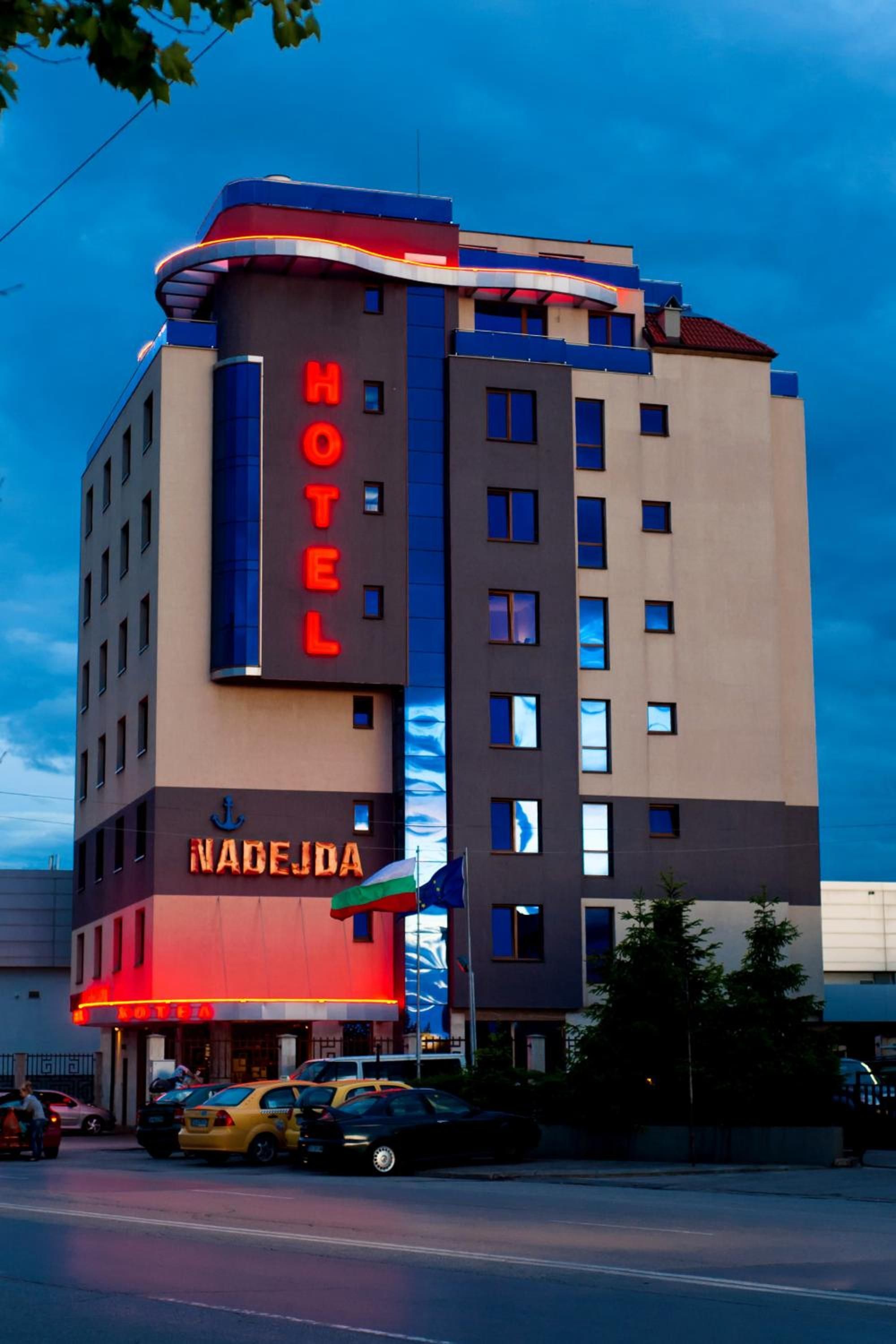 A multi-story hotel with a prominent 'HOTEL' sign on the facade.