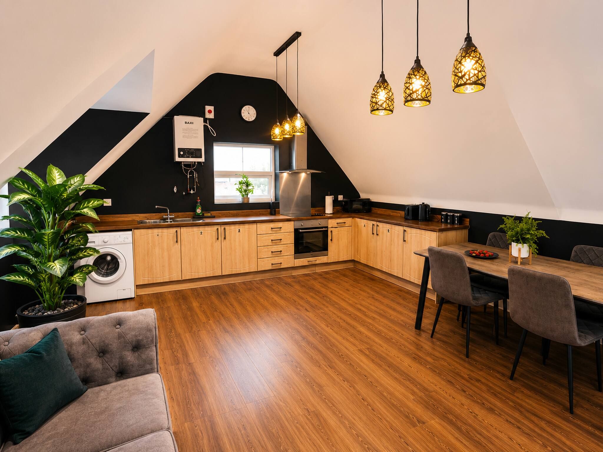 A modern kitchen with wooden cabinets, a built-in oven, and a dining area with a table and chairs.