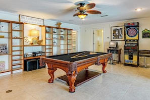 A pool table in a room with a ceiling fan, a dartboard, and a billiards machine. - Bring Your Boat! Waterfront Clearwater Gem w/ Pool (Clearwater)