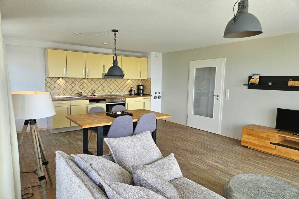 Un espacio moderno para vivir con comedor, cocina y zona de estar.