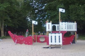 A playground with a climbing structure and slides. - Type 2 in the Schwardt house (Kellenhusen)