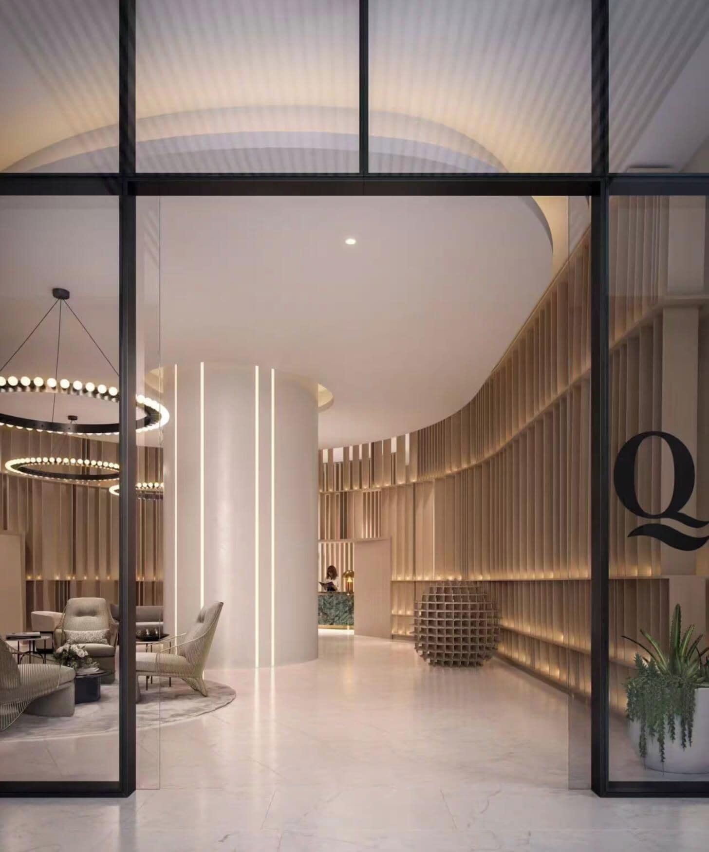 A modern interior with a reception desk, seating area, and a curved ceiling design.