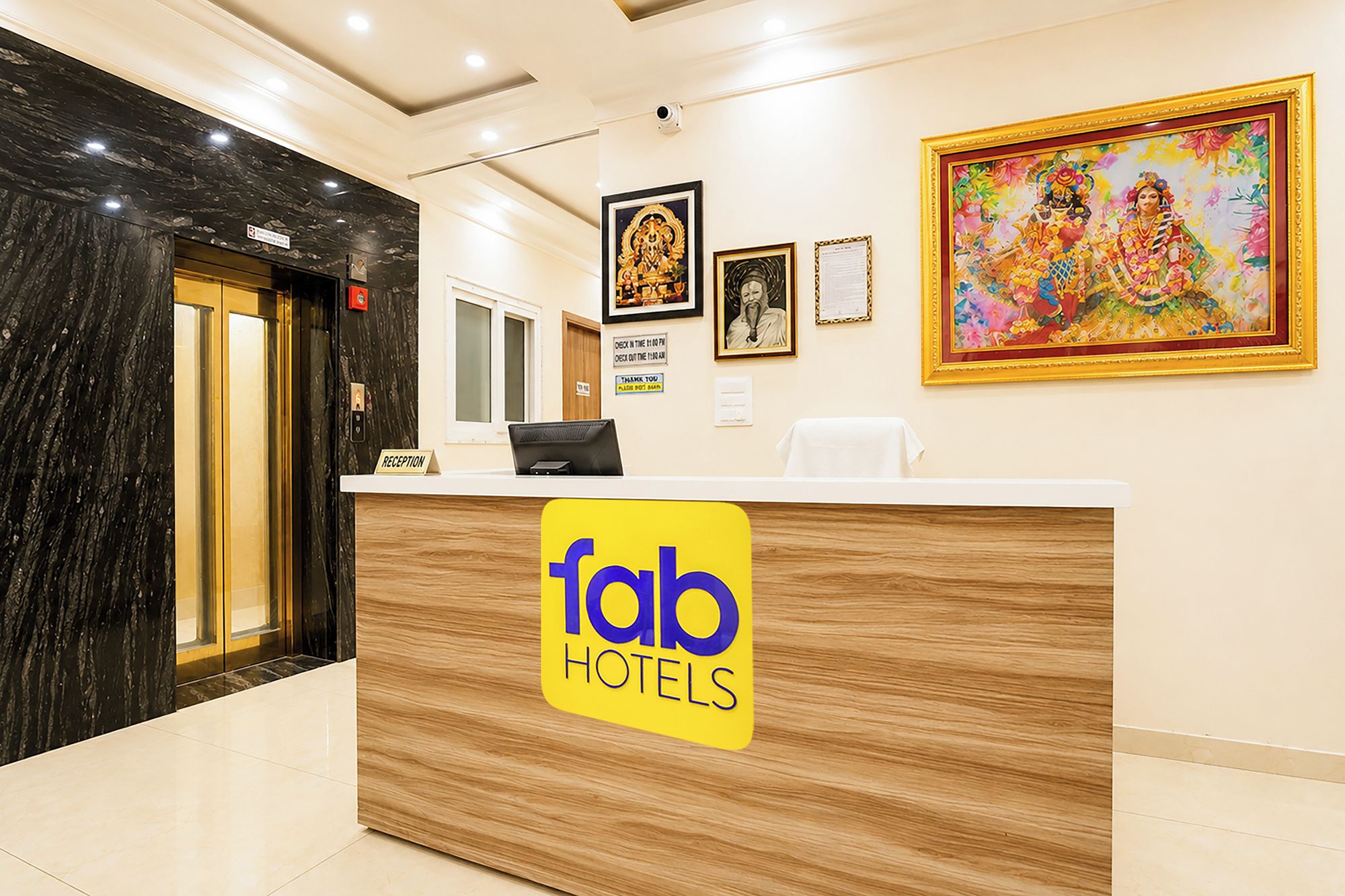 A hotel reception desk with a sign reading 'Tab Hotels'.