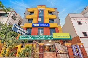 A multi-story building with signage for 'Sri Ganesh Swathi Residency' and 'Tab Hotels'. - FabHotel Sgs Residency (Visakhapatnam)