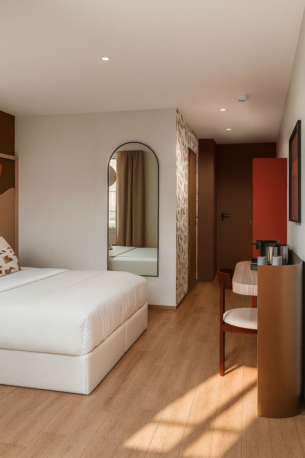 Una habitación de hotel moderna con una cama grande, un escritorio y un espejo.