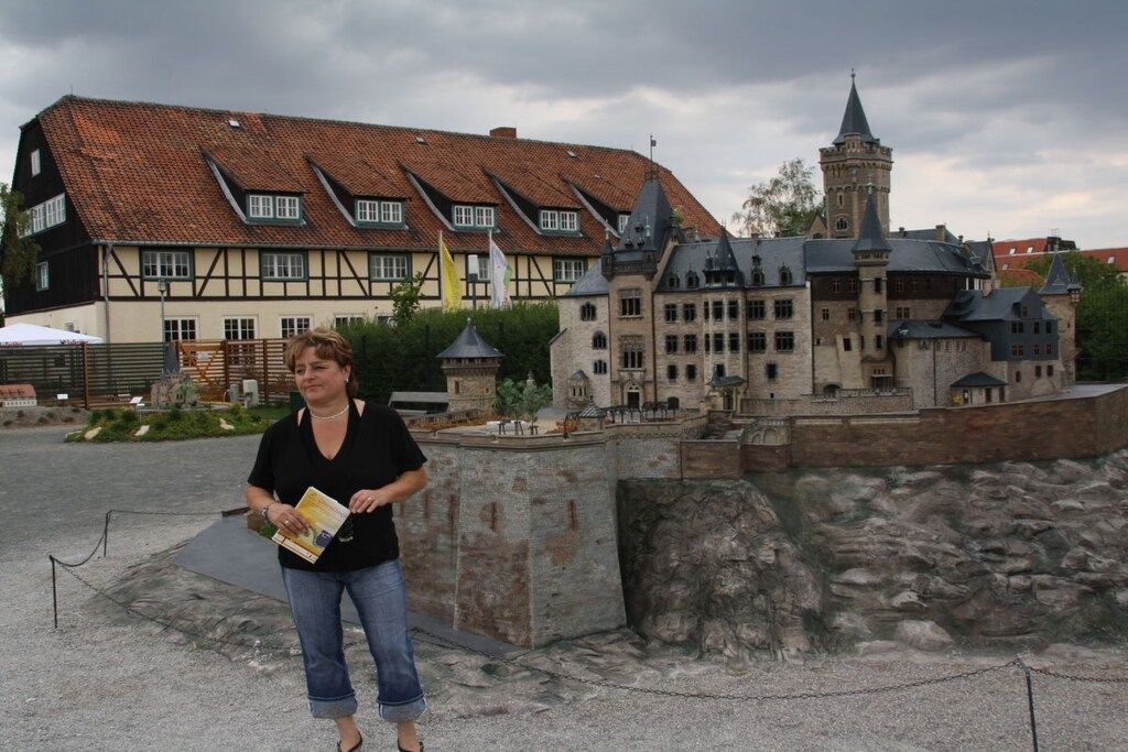 A historic building with a prominent tower and a traditional facade.