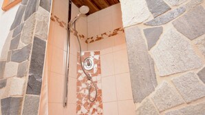 A stone shower enclosure with a wooden ceiling. - Lovely apartment for 4 people with WIFI, TV and balcony (Hopfgarten Im Brixental)