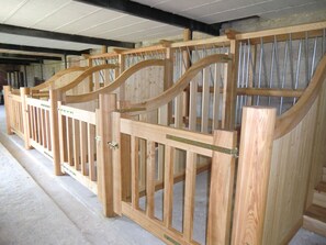 A wooden structure with a curved design, possibly a part of a building's interior.